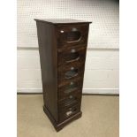 A stained mahogany haberdasher's chest of six glass fronted short drawers on a bracket foot base,