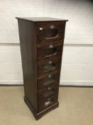 A stained mahogany haberdasher's chest of six glass fronted short drawers on a bracket foot base,