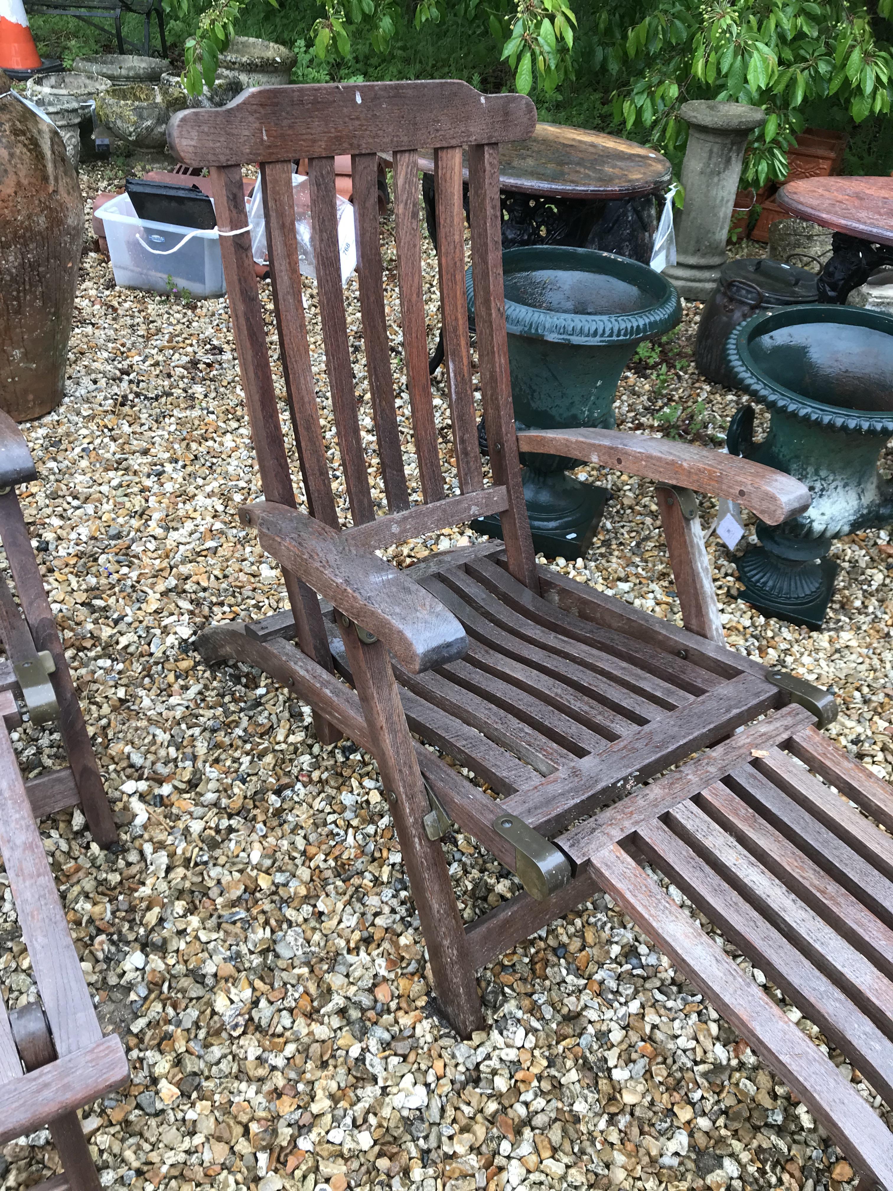 A pair of teak slatted garden steamer type chairs CONDITION REPORTS Have general - Image 2 of 11