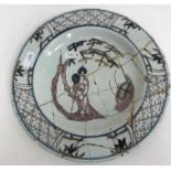 Two 18th Century Bristol Delft plates, the centrefields decorated with woman and fan beneath a tree,