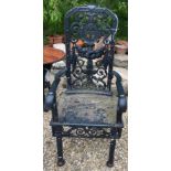 A black wrought iron high backed arm chair (possibly previously scales converted)