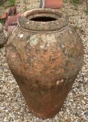A terracotta olive pot,