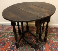 WITHDRAWN An 18th Century oak oval gate-leg tea table of small proportions, with single end drawer,