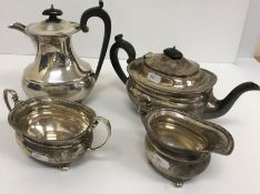 A George V silver four piece tea set comprising teapot, hot water jug,