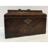 A George III mahogany sarcophagus shaped tea caddy with ornate brass swan neck handle 25.