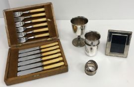 An early 20th Century Roberts & Belk silver and mother of pearl handled part fruit set (missing one