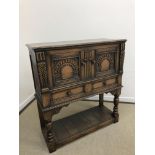 An oak court cupboard or wine cabinet attributed to Titchmarsh & Goodwin in the 17th Century style,