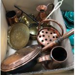 A collection of various copper and brass ware to include an iron-handled beer skimmer,