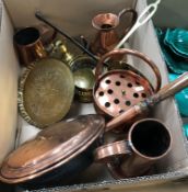 A collection of various copper and brass ware to include an iron-handled beer skimmer,