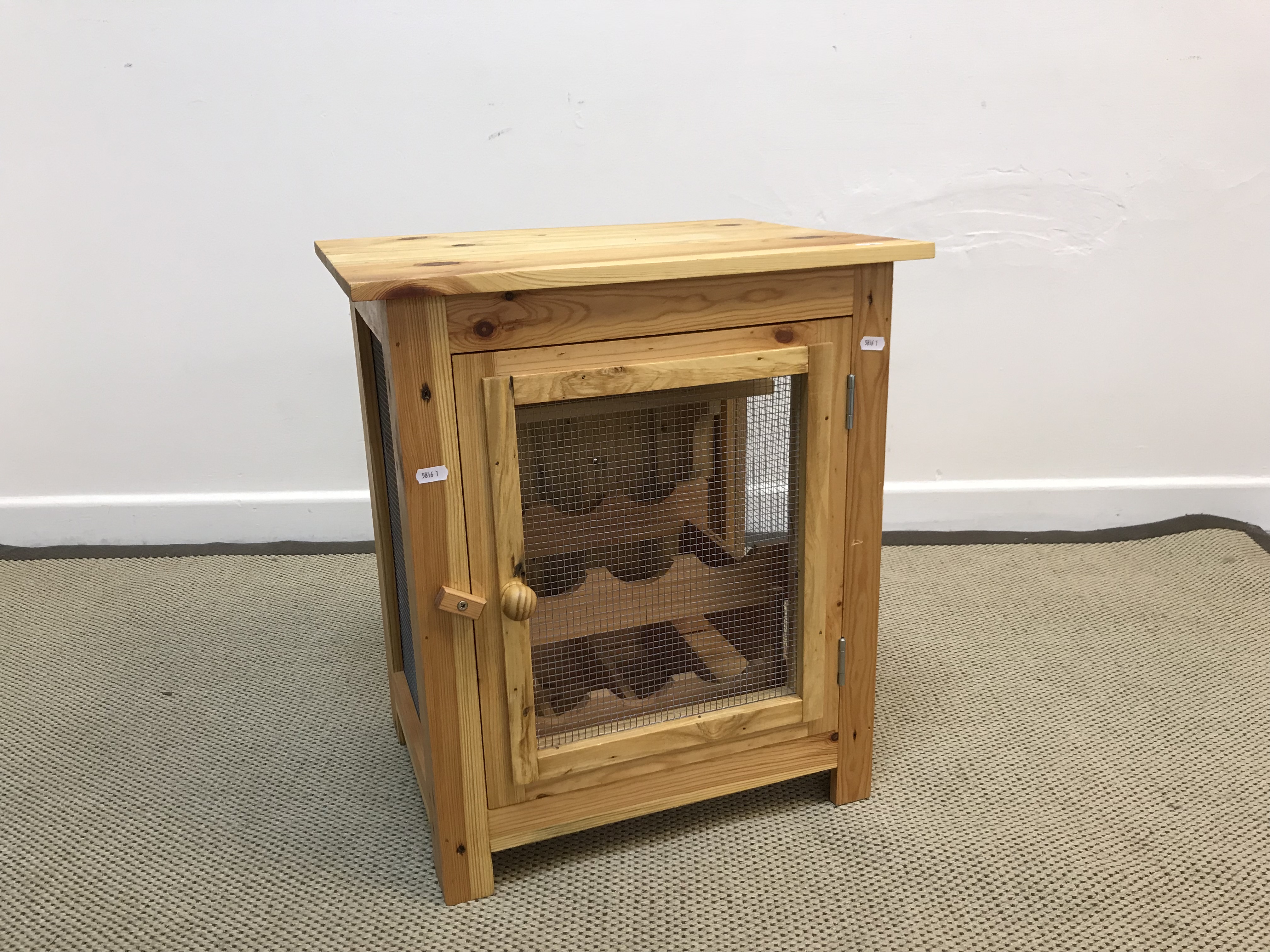 A modern pine and wire work six section wine storage cabinet of meat safe form