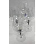 A set of ten Orrefors blue bubble glass decorated wine goblets and ten matching water glasses and