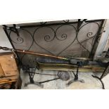A wrought iron spark guard together with a pierced brass fender, brass warming pan,