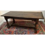 An early 20th Century oak refectory style dining table in the 18th Century manner,