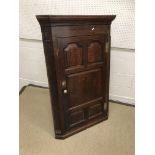 A circa 1800 oak hanging corner cupboard,