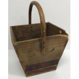 A wooden bucket of square tapering form with fixed handle, 47 cm high,