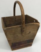 A wooden bucket of square tapering form with fixed handle, 47 cm high,