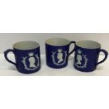 Three Wedgwood blue Jasperware royal commemorative mugs for Edward VIII 1937 and George VI and