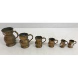 A graduated set of six Victorian brass measures including pint, half pint, gill,