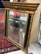 A 20th Century gilt framed overmantel mirror in the 19th Century style with rectangular bevel edged