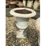 A pair of white painted Regency style cast iron garden of campana form 42cm high