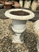 A pair of white painted Regency style cast iron garden of campana form 42cm high