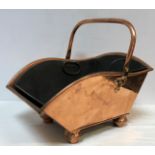 A Victorian copper coal scuttle with swing handle by Henry Loveridge of Wolverhampton circa 1886,