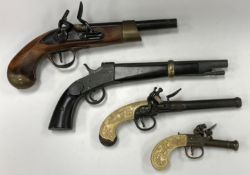 Three various replica flintlock pistols and a replica hammer action pistol