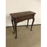 A 19th Century walnut tea table in the early 18th Century manner,