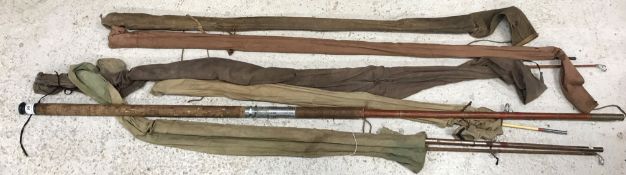 A collection of five various split cane and fibreglass fishing rods