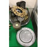 A collection of metal wares to include fifteen pewter dinner plates, two pewter oval serving plates,