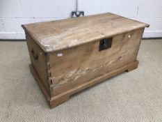 A Victorian pine blanket box with rising lid opening to reveal a plain interior raised on bracket