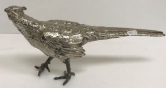 A silver plated model of a Cock Pheasant,