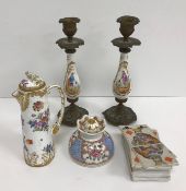 A pair of 19th Century porcelain and cast brass baluster shaped candlesticks,