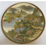 A 20th Century Japanese koshida satsuma plate decorated with a lakeland montainous landscape with