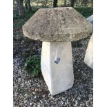 A stone topped staddle stone with weathered composite stone base CONDITION REPORTS