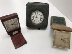 Three early 20th Century leather cased travel clocks,