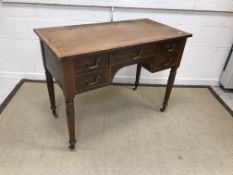 A 19th Century mahogany and satin strung side table with central drawer flanked by two pairs of