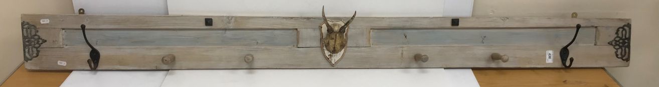 A painted pine coat hook with antler decoration 15.