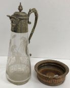 A Victorian claret jug with cut decoration of monkeys amongst palm trees with plated mounts (chip