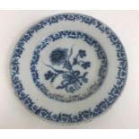 A collection of various Delft ware including a small circular plate with central floral spray