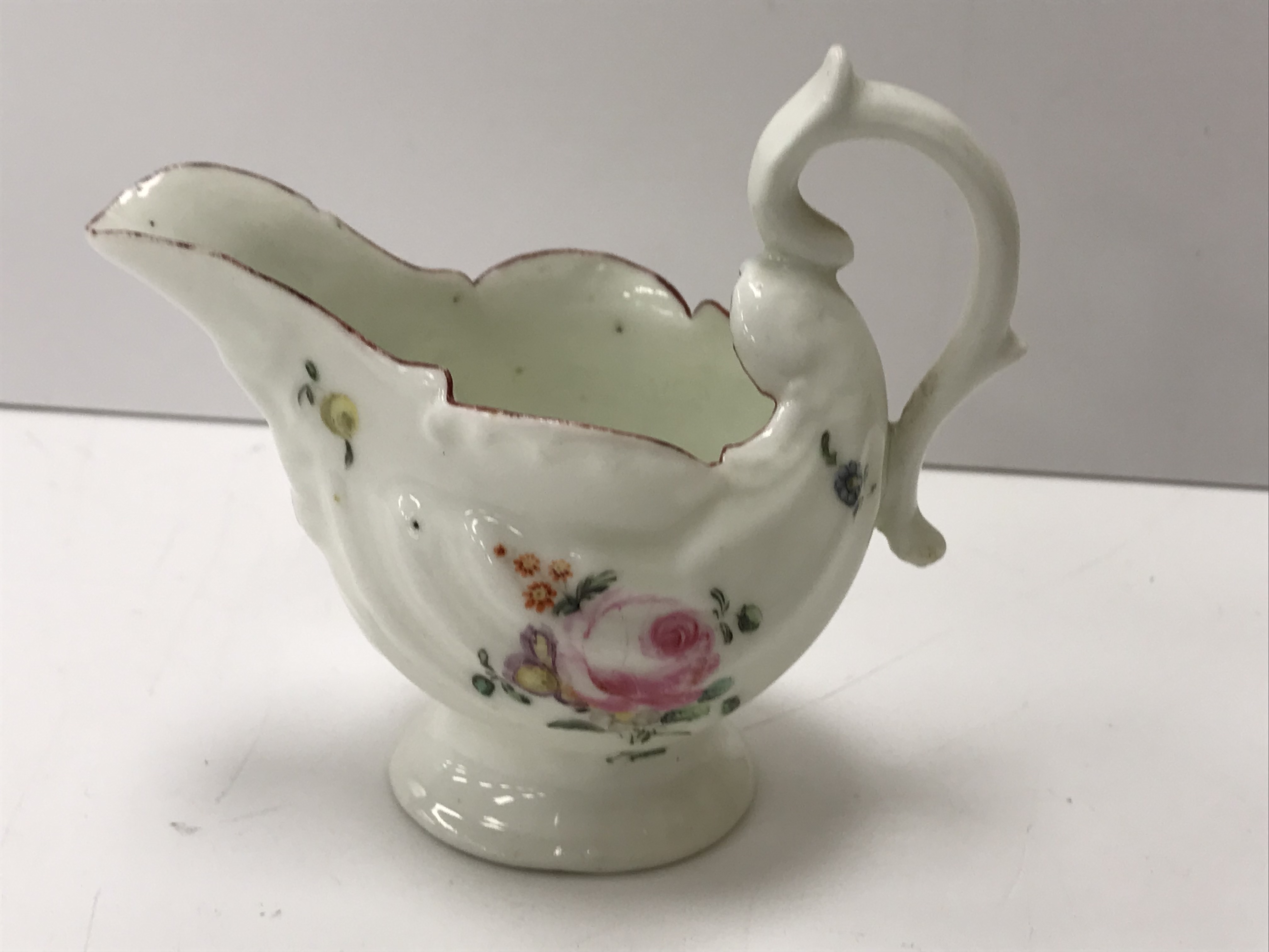 An 18th Century silver shaped Chelsea type cream jug with relief work foliate decoration and floral - Image 20 of 30