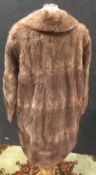 A musquash fur jacket,