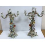 A pair of early 20th Century Continental porcelain candelabra,