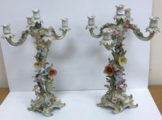 A pair of early 20th Century Continental porcelain candelabra,