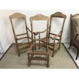A pair of modern elbow chair frames with scroll finials and carved decoration,