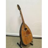A Skylark brand guitar model MGM991 with lute shaped body,