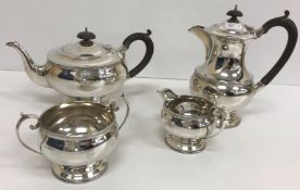 A George VI silver tea set comprising teapot, hot water jug,