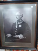 A framed and glazed photographic portrait of "A gentleman seated in military uniform",