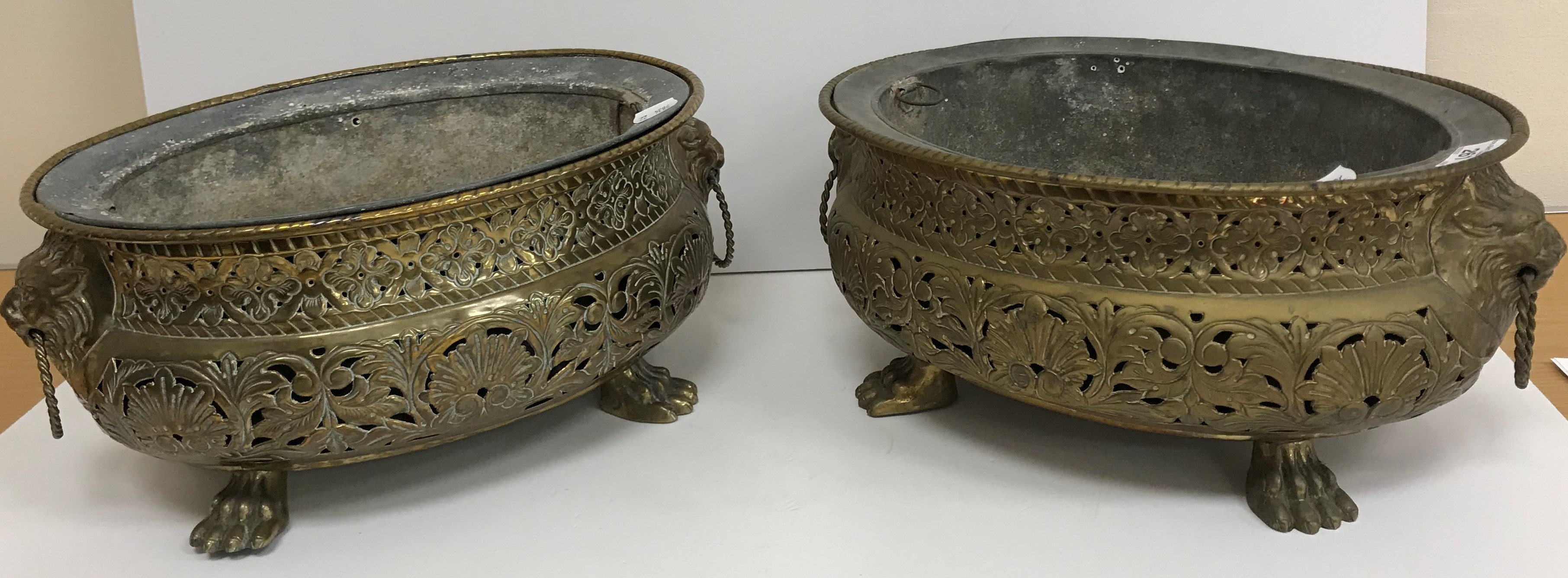 A pair of 19th Century Dutch pierced brass wine coolers of oval form,
