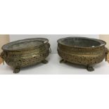 A pair of 19th Century Dutch pierced brass wine coolers of oval form,